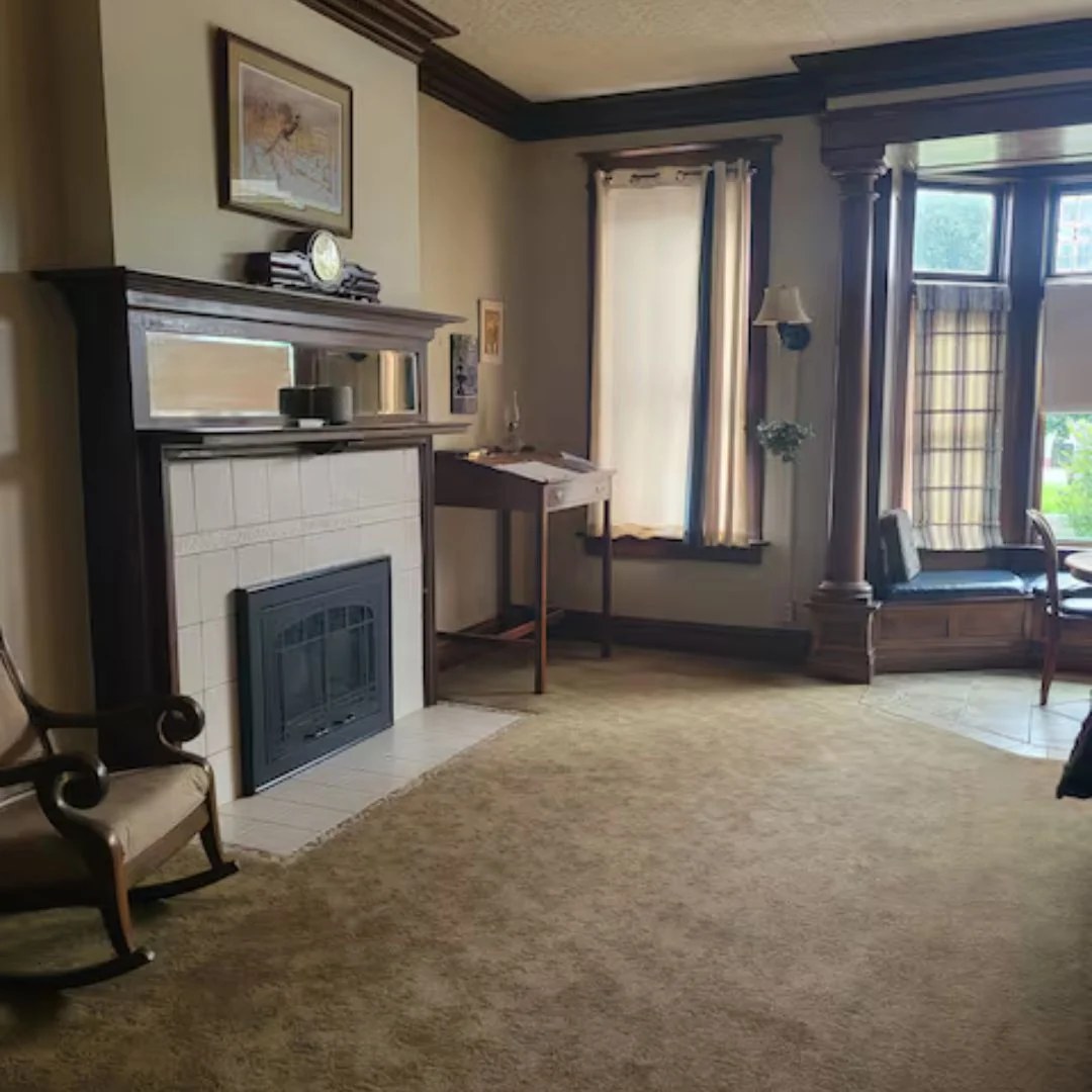 Parkview dining room with table beneath a beamed ceiling