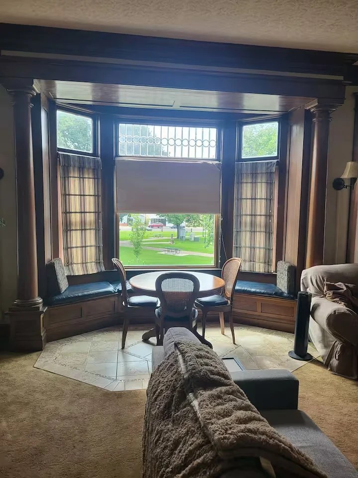 Parkview's table framed by the grand front bay window and park view